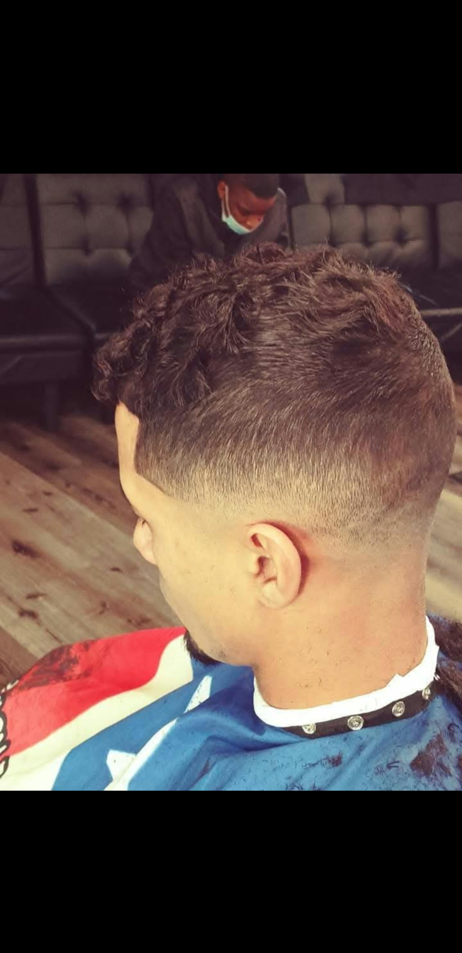 Chad — textured curly top with taper fade