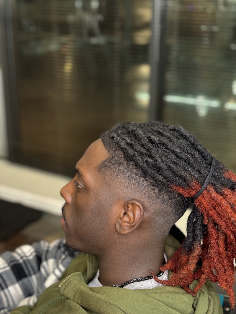Kris — locs with sharp fade and lineup