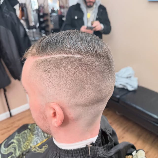 Finished haircut — sharp fade from behind
