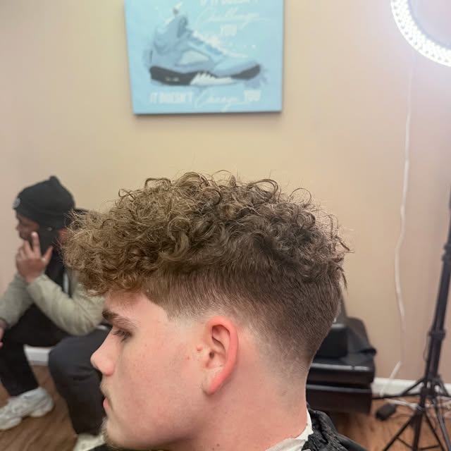 Textured curls with mid fade