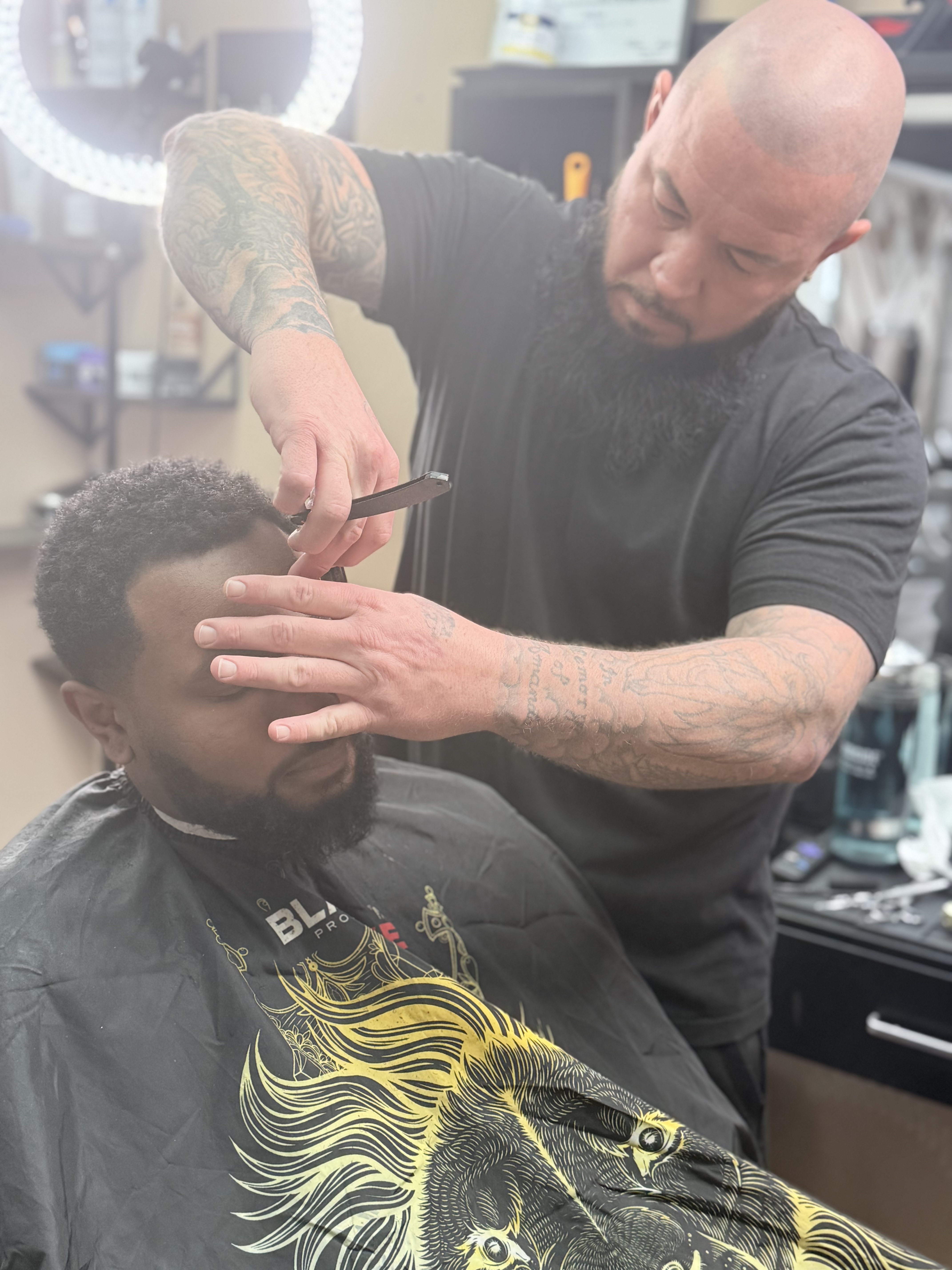 Joe doing precision razor work on a client